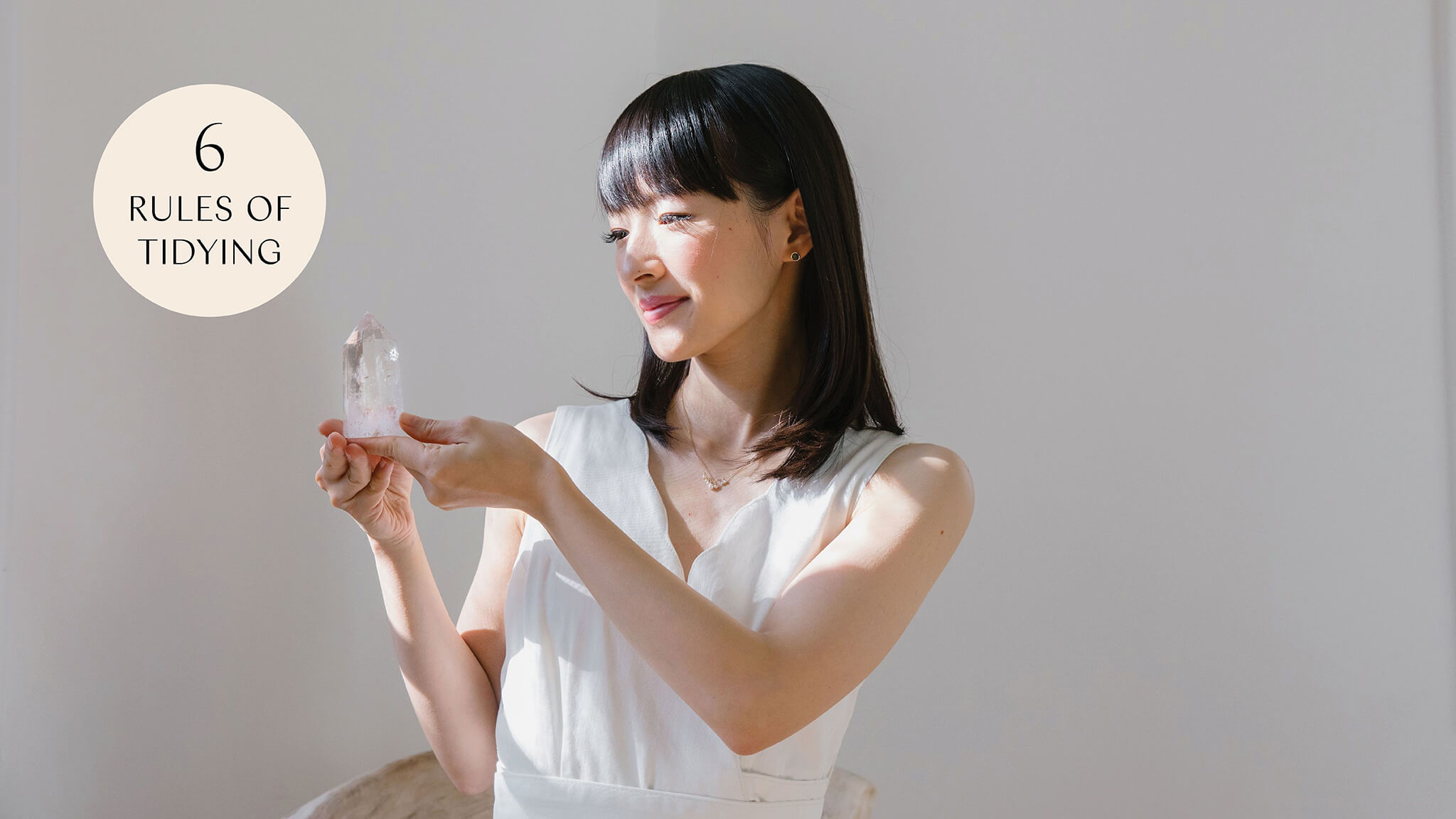 Marie Kondo holding a crystal