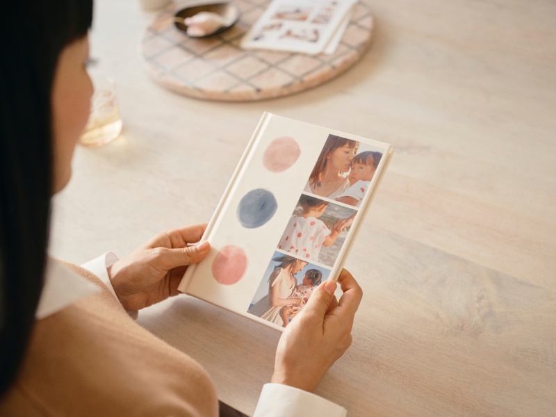 Marie Kondo holding a personalized journal